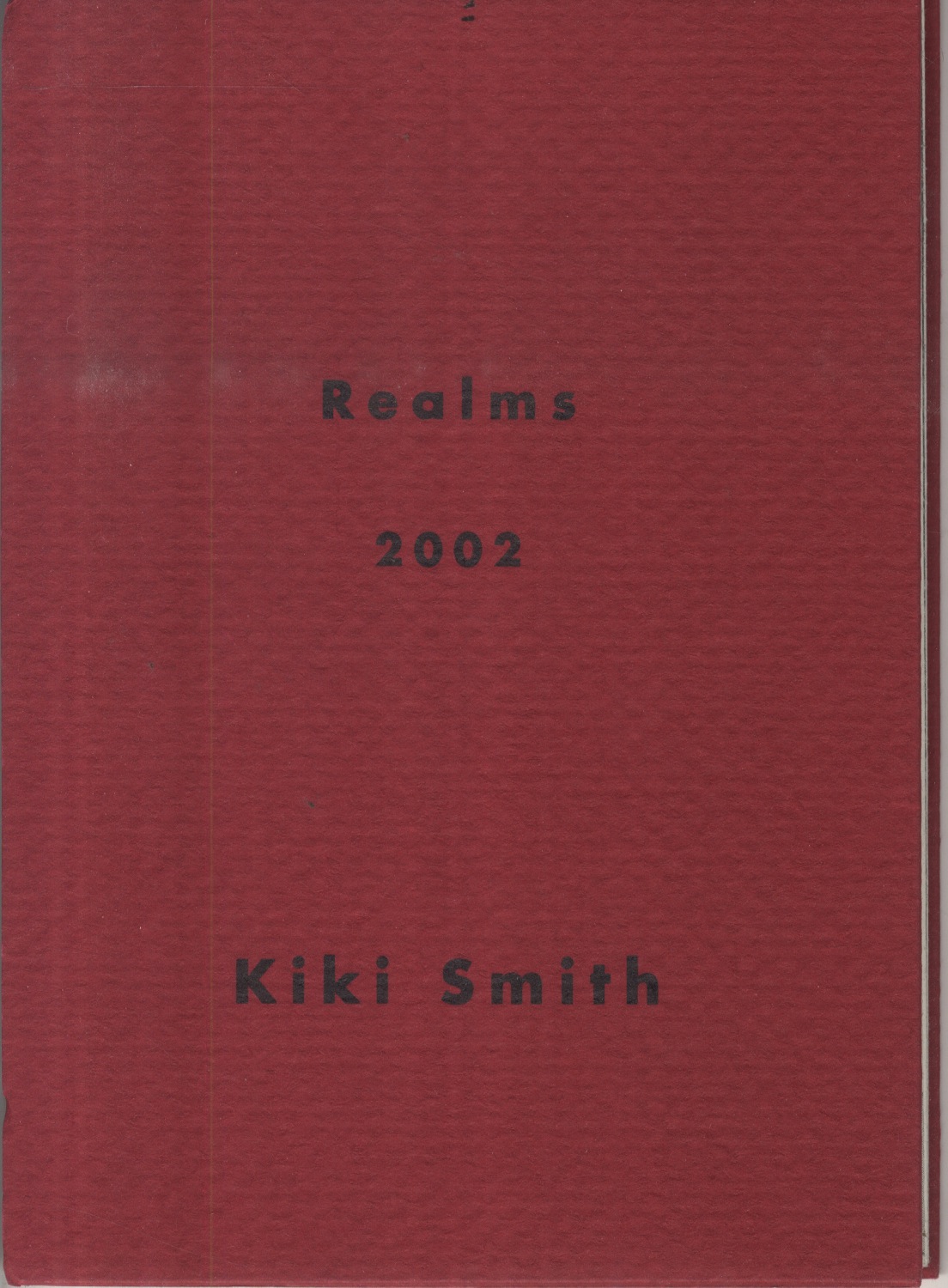 Deep red book cover with embossed texture and title in the center 