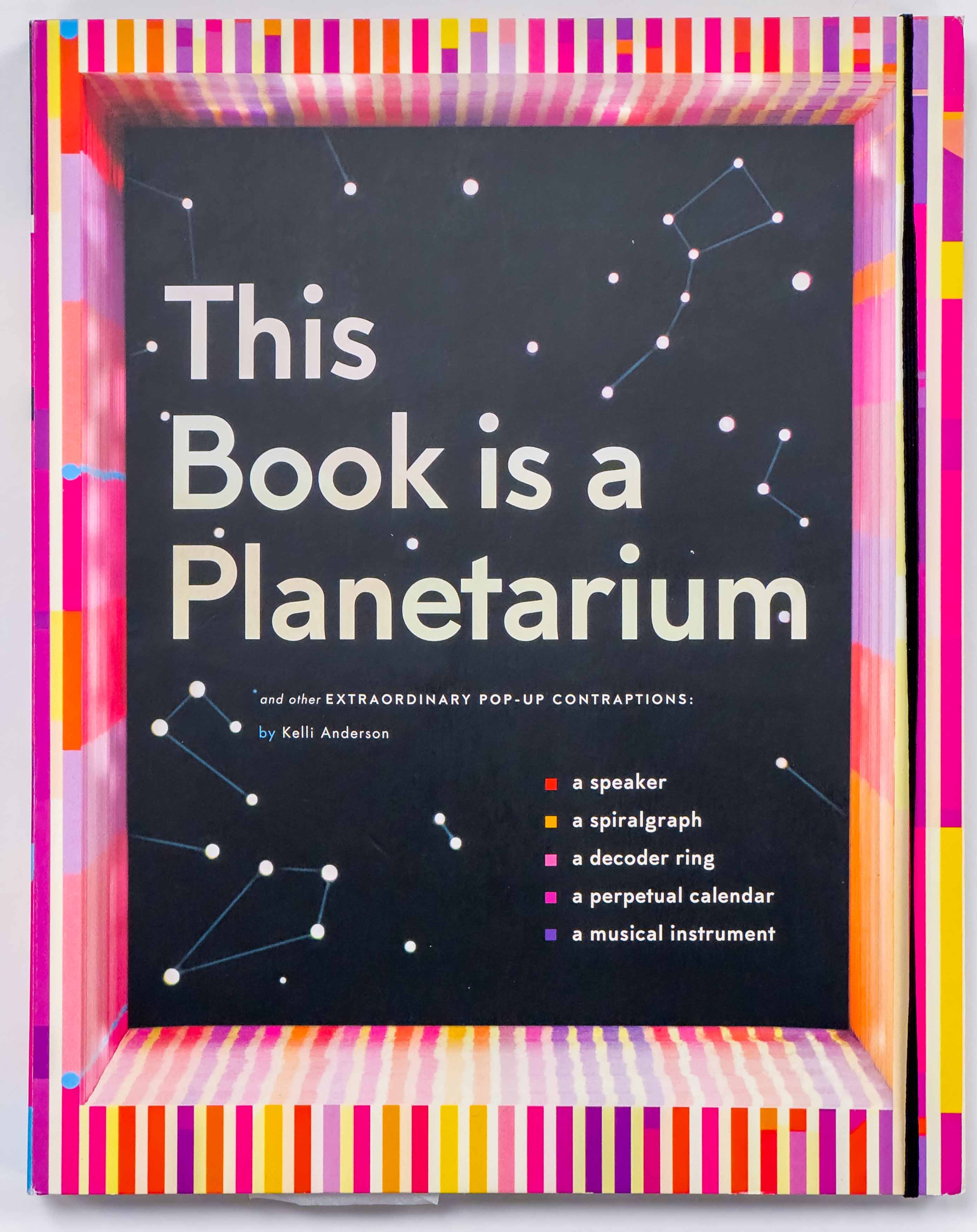 Striped pink, orange and purple frame with a black and white constellations along with the title on the cover