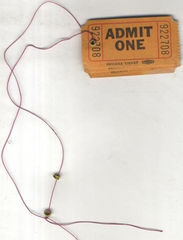 Vintage movie tickets with a string attached