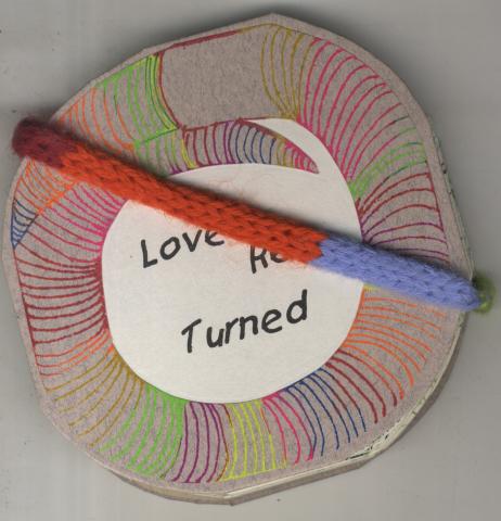 Circular bookcover with multi colored lines inside a a drawing that looks like tale, title in black in the center and a woven band that goes across the bookcover. 
