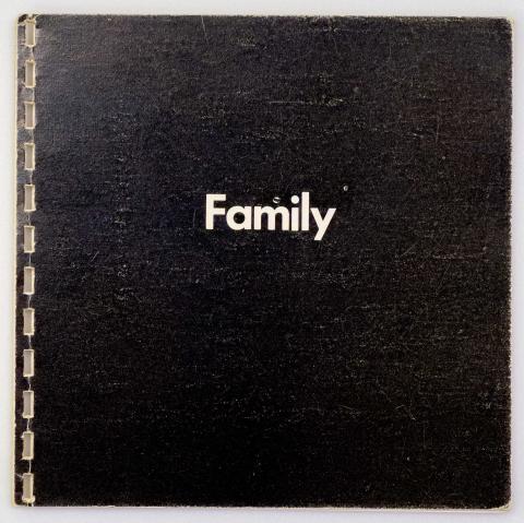 Black cover of a book with the word Family in white text. 