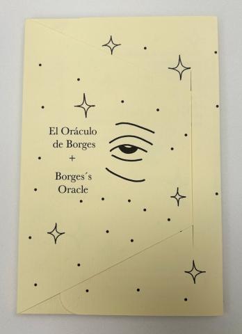 "El Oráculo Borges + Borges's Oracle" is written on the front light yellow cover in black text. Companying it is the black outline of stars, dots and an eye. 