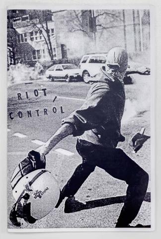 Image of a person standing in the street, throwing an object. The title, "Riot / Control,"  appears to be stamped to the left of the person.